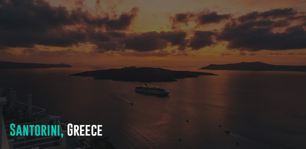 a view of the sunset outside a hotel room with a cruise passing by
