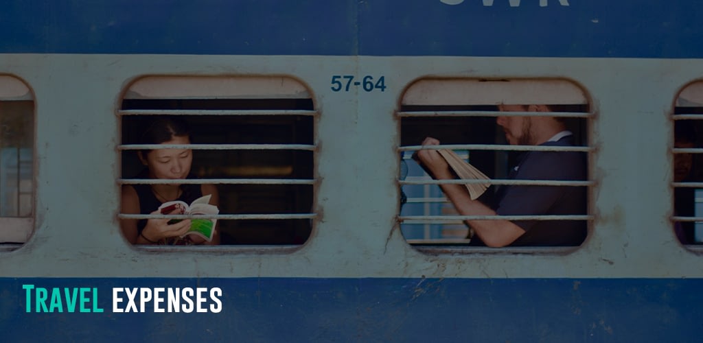 man and woman sitting on a train while reading a book