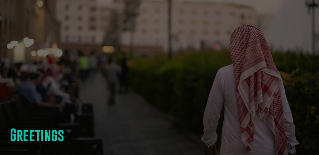 a person wearing a traditional Muslim clothing walking at the streets