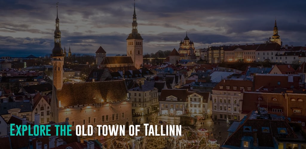 a view of the old town of Tallin as it shift to night time and buildings and streets starts to light up.