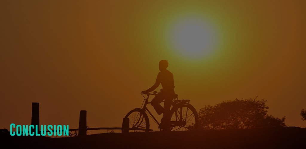 a person biking at a view of the sunset