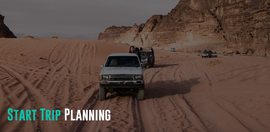 a line of Bedouin`s car jeeps with tourists in Wadi Rum desert in Jordan