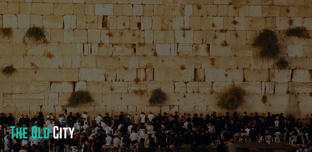 A wall filled with people praying.