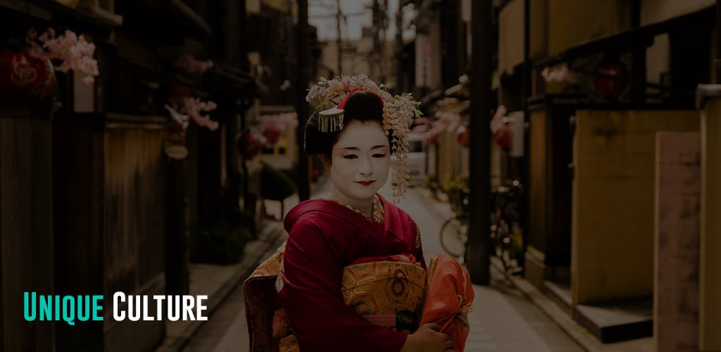 A photo of a smiling geisha looking towards the camera.