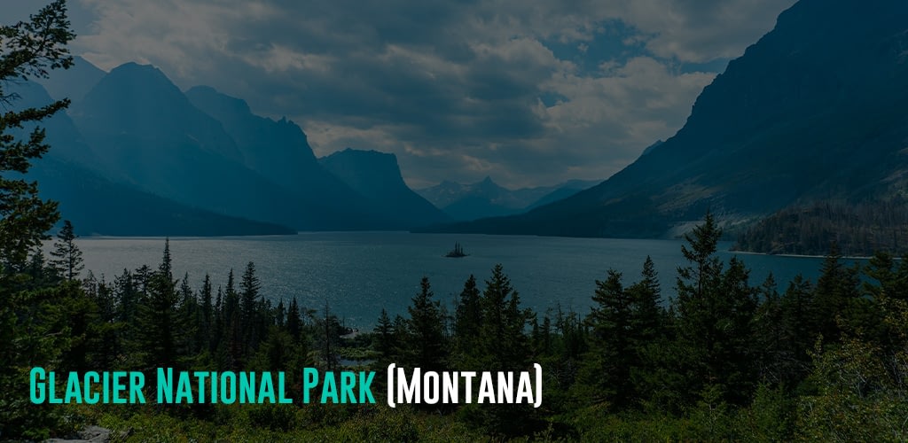 A view of the lake surrounded by towering mountains covered in trees