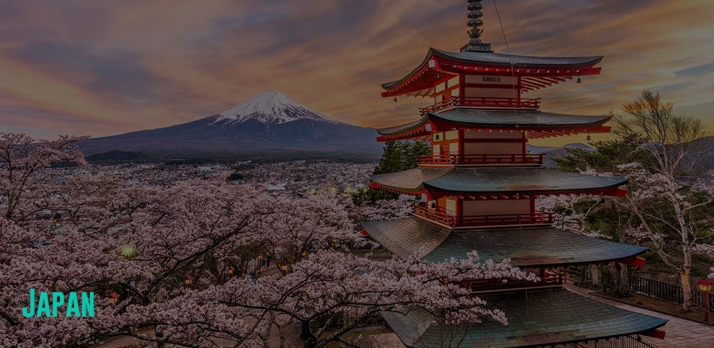 a view of Mount Fuji during a Spring Sunset with Cherry Blossoms aorund