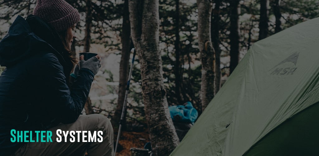 a woman drinking coffee while camping