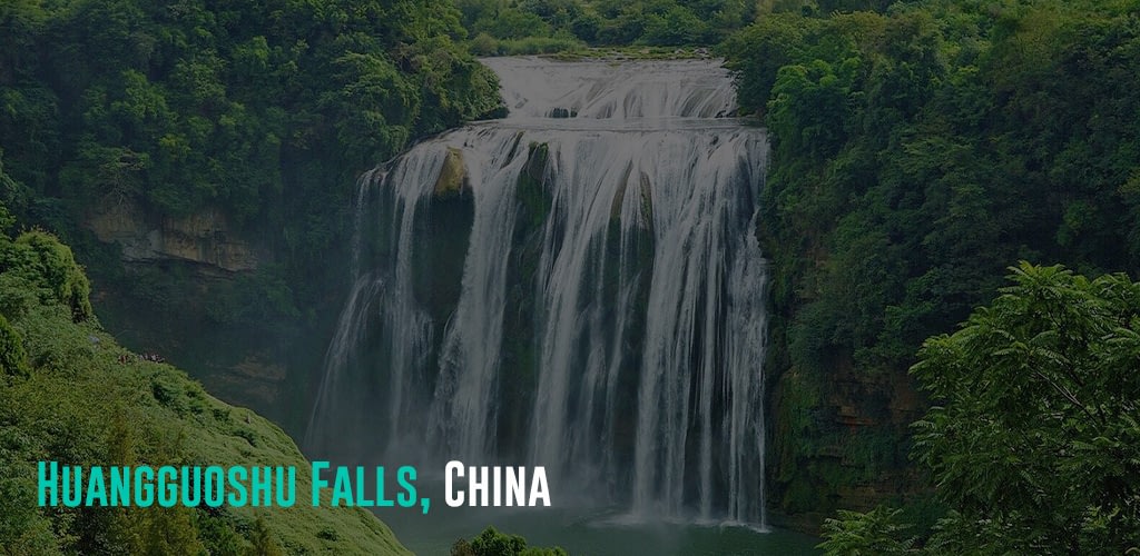 a view of the Huangguoghu Falls in the middle of a forest