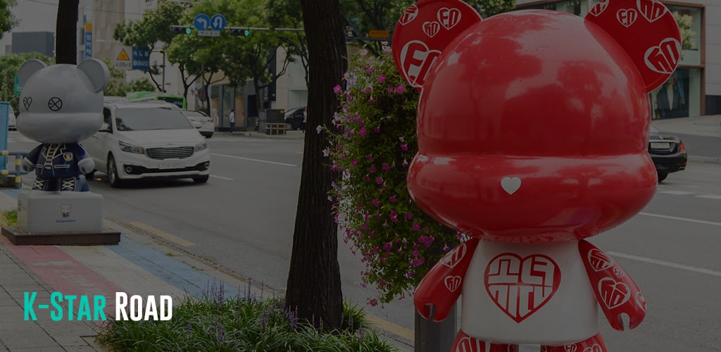 a cute red bear statue at the streets