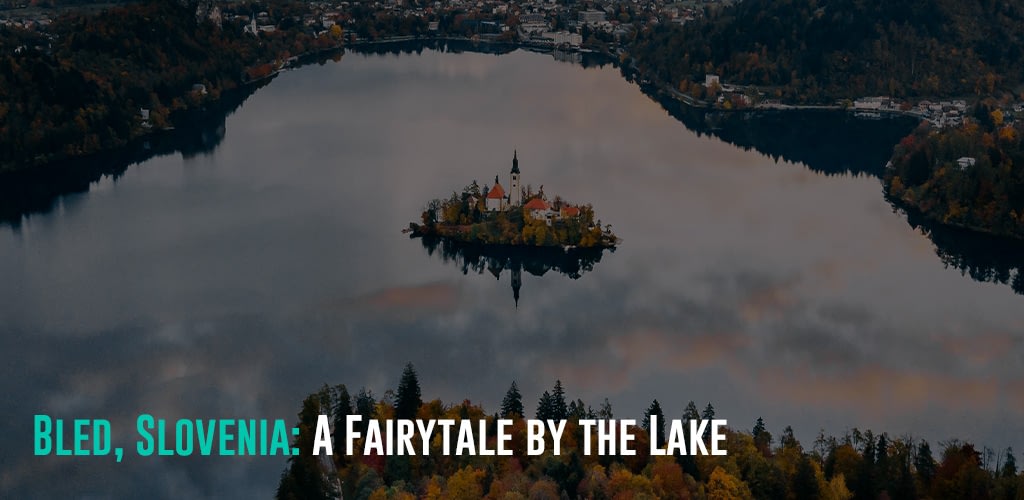 a fairytale like view of the Bled in Slovenia, where a small castle/house is on a small island in the middle of the lake