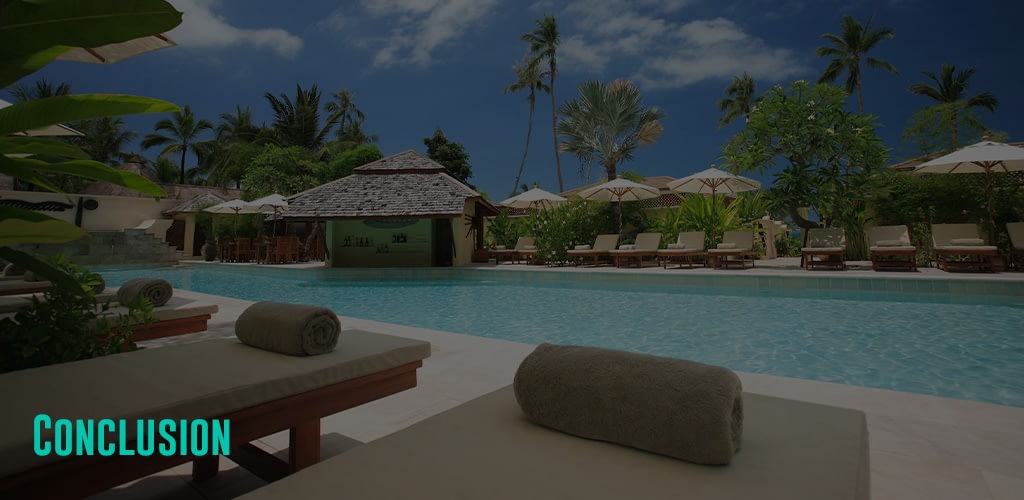 beach towels on the loungers beside the pool