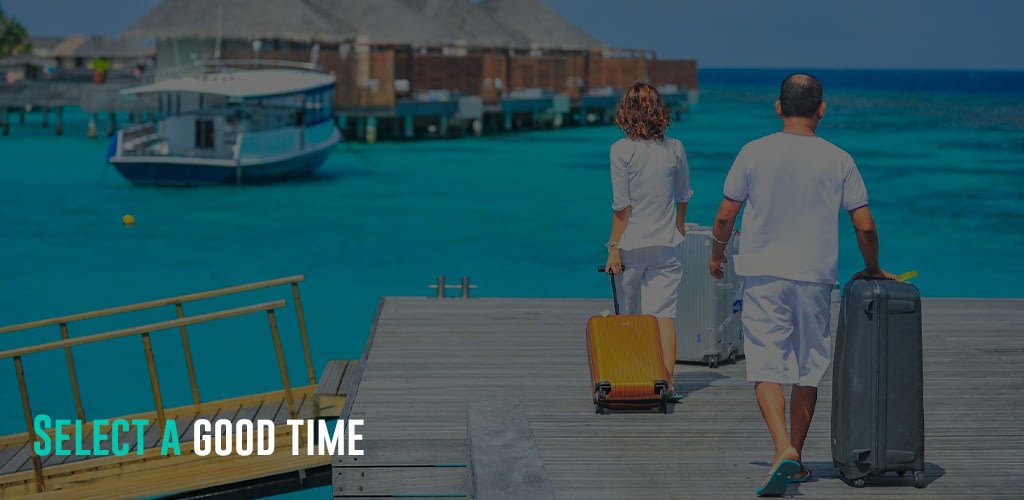 a couple with their luggage at the port.