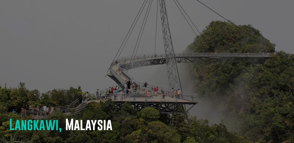 people crossing a walking bridge