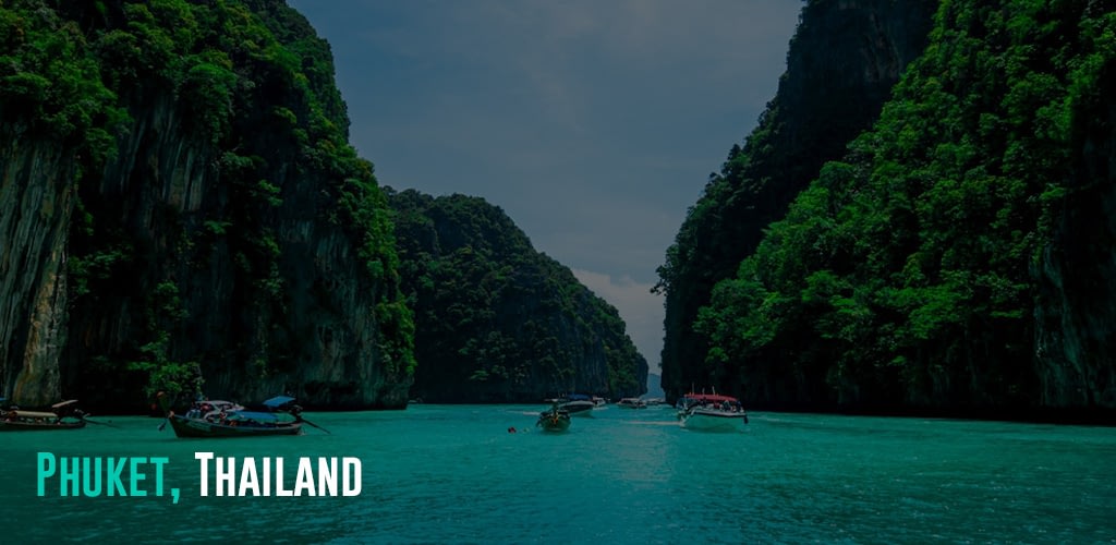 Boats passing through rock islands and beautiful turquoise ocean